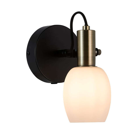 Modern wall light Arild with a round opal glass shade and brass details, adjustable lamp head.