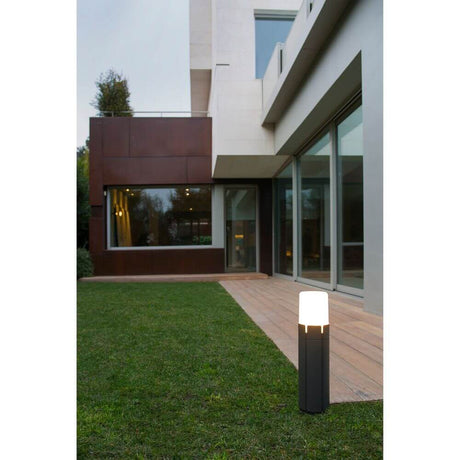 TRAM path light 63cm IP65 Dark gray in the garden next to a modern house.