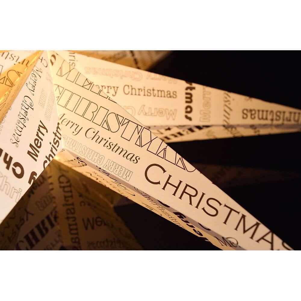 Weißer Papierstern mit schwarz bedrucktem Text 7 Zacken ohne Leuchtmittel - festliche Weihnachtsdekoration.