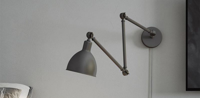 Schwenkbare Wandleuchte in modernem Design, ideal für stilvolle Innenräume.