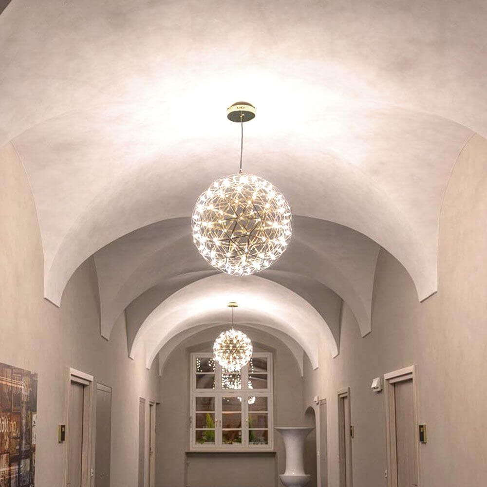 s.luce Atom LED pendant light in a modern hallway with atmospheric light play and elegant room design.