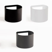 drei runde Abdeckungen in Schwarz und Weiß für die Ixa Wandleuchte von s.luce, modern und modular.