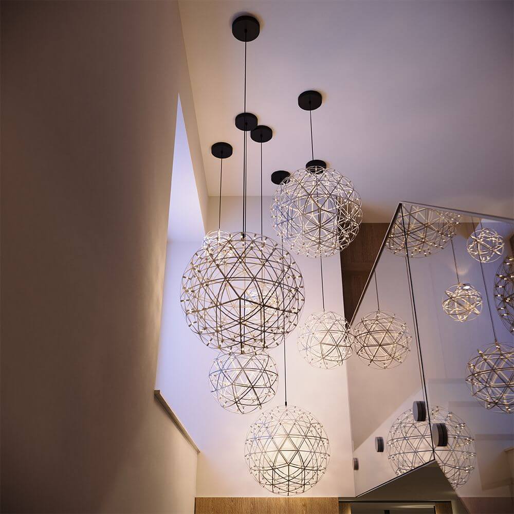 s.luce Atom LED pendant light: modern design lighting in a stylish room with geometric shapes.