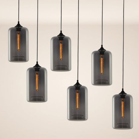 s.luce Cruet flerflammet pendellampe i moderne design med grått glass og ulik plassering.