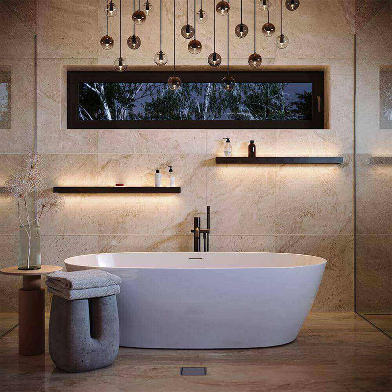Modern bathroom with freestanding bathtub, stylish light, and elegant decor.