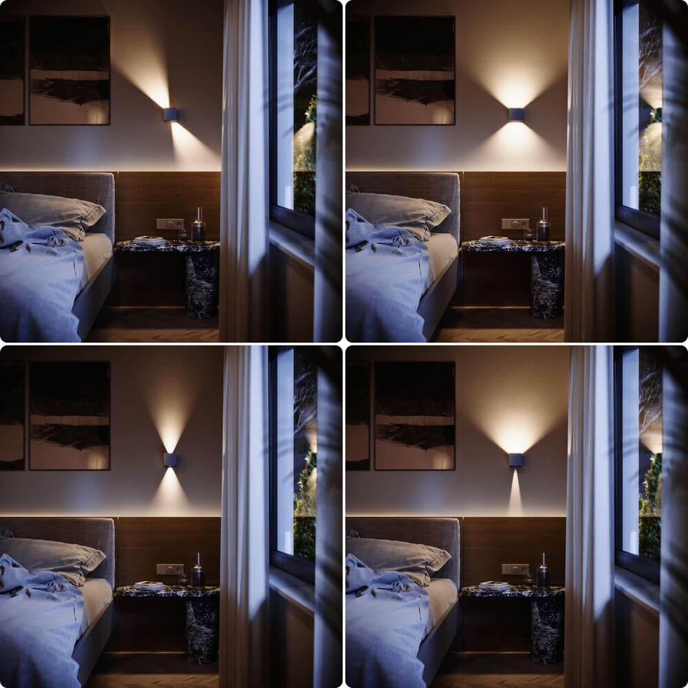 s.luce Ixa LED Wandlamp verstelbare hoeken binnen & buiten IP44 aan een slaapkamerwand met gezellige verlichting.