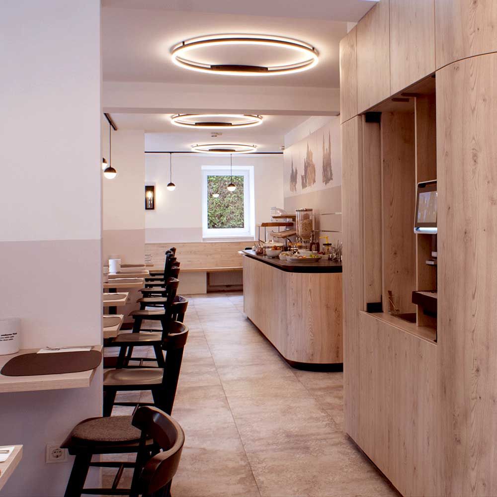 s.luce LED Aplique de parede e candeeiro de teto Ring Regulável moderno redondo num restaurante moderno com iluminação elegante.