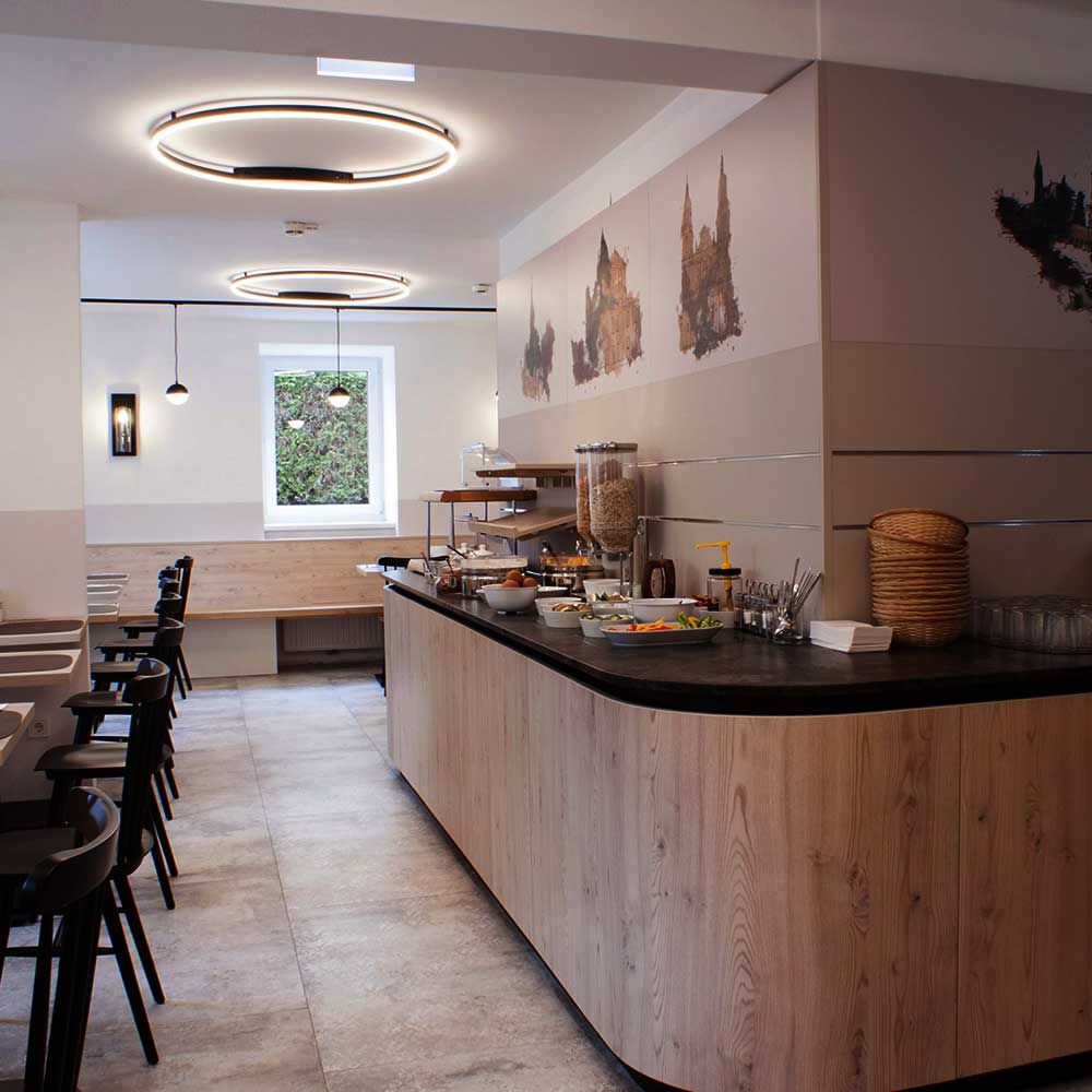 s.luce LED Aplique de parede e candeeiro de teto Ring Regulável moderno redondo em ambiente de cozinha elegante com iluminação clara.