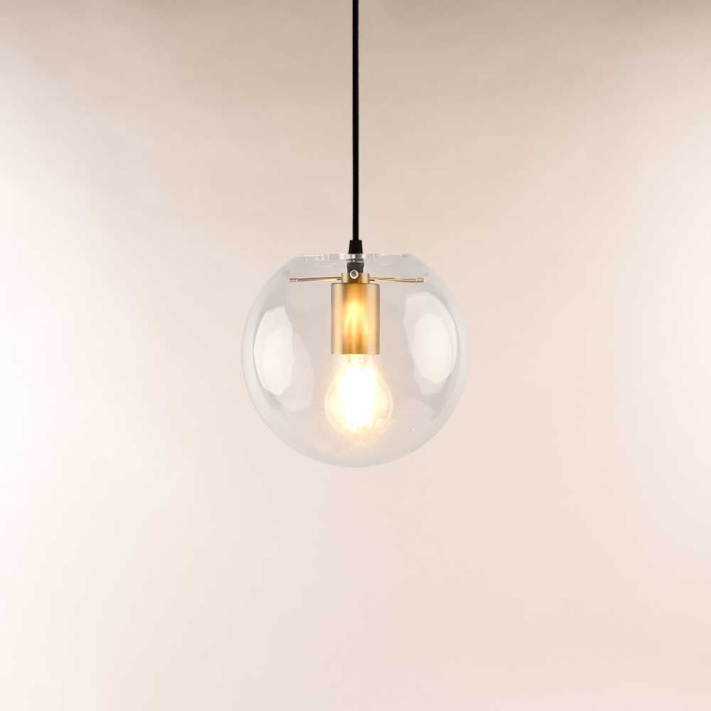 s.luce Orb glass ball pendant light in clear glass ball with warm light.