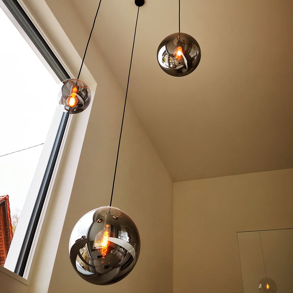 s.luce Orb glass ball pendant light in modern decor, stylish pendant lights over windows.