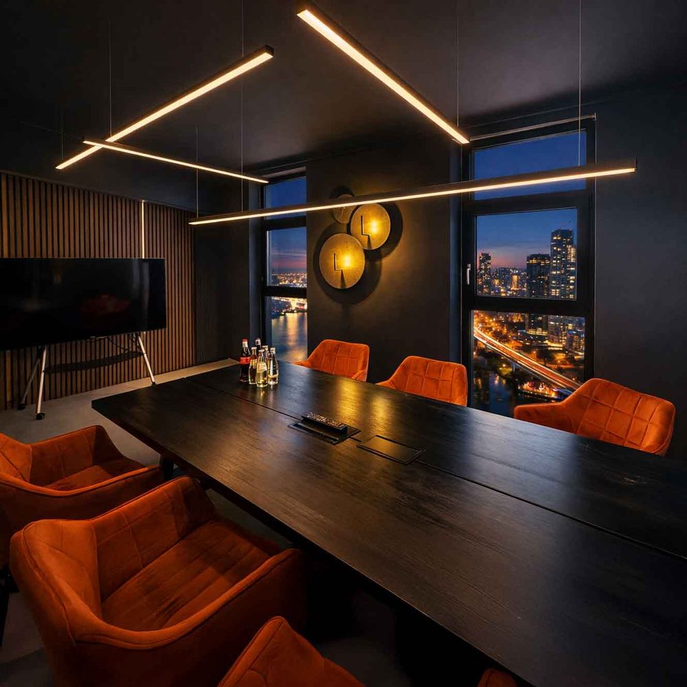 s.luce Oris LED linear light office pendant lamp XL made to measure 4000K in a modern conference room with orange chairs.