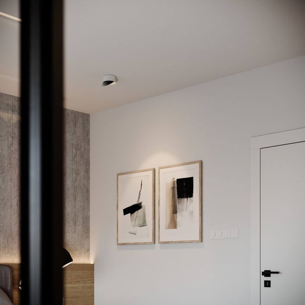 Moderne Inneneinrichtung mit abstrakten Bildern und LED-Deckenstrahler in einem stilvollen Raum.