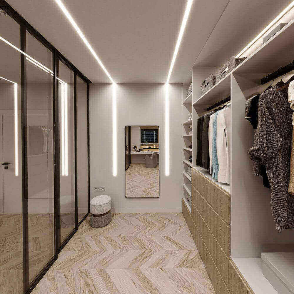 Moderne Garderobe mit Wandspiegel, heller Beleuchtung und stilvollen Schränken, ideal für stilbewusste Einrichtung.