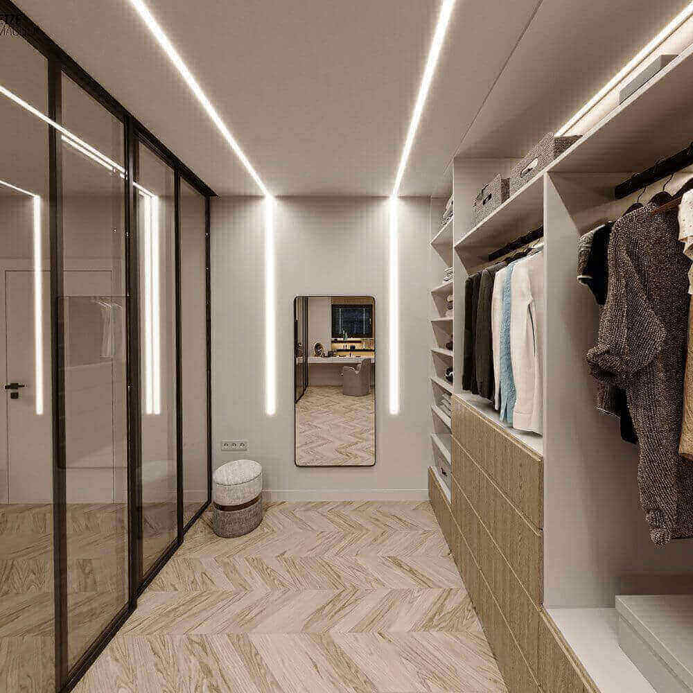 Moderne Garderobe mit Wandspiegel, heller Beleuchtung und stilvollen Schränken, ideal für stilbewusste Einrichtung.