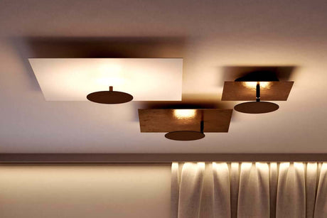 Moderne Leuchten für Rasterdecken in edlem Design mit runden und quadratischen Formen.