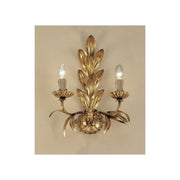 Palma 2-light wall light with antique leaf gold finish, 40 cm, with golden blossoms and candle lamps.
