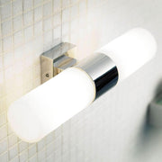 Applique Tangens cromata dal design moderno per l'illuminazione del bagno, elegante e funzionale.
