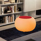 Moree Bubble Tisch oder Hocker mit orangefarbenem LED-Licht und rotem Aufsatz in modernem Wohnraum.