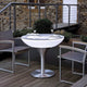 Moree Lounge Table Outdoor Tisch 45cm auf einer Terrasse mit Essgeschirr und Stühlen.
