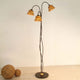 Stehleuchte 3-flammig Snail One Eisen Braun-Schwarz-Gold mit elegantem Design und warmem Licht.
