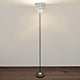 Stehleuchte Banderole Eisen Schwarz-Silber moderne Stehlampe aus Eisen mit stilvollem Design und energiefreundlicher Beleuchtung.