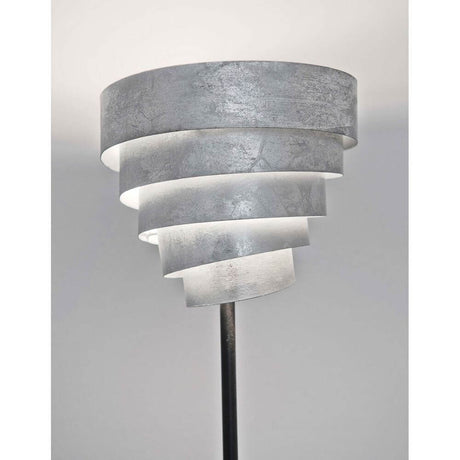 Lampada da terra Banderole in ferro nero-argento con paralume a forma di spirale e design moderno.