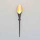 Wandleuchte Fiaccola Grande Eisen Braun-Schwarz-Gold an einer Wand montiert, modernes Design in elegantem Stil.