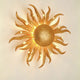 Wandleuchte Sonne Piccola Eisen Gold mit goldenen Strahlen. Dekorative Wandlampe für stilvolles Ambiente.