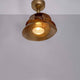 Deckenstrahler Snail Eisen Gold mit modernem Design und glänzender goldener Oberfläche.