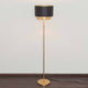 Stehleuchte Mattia Rund Eisen Gold-Schwarz im minimalistischen Design mit schwarzem Lampenschirm und goldener Stange.