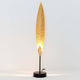 Tischleuchte Penna Eisen Gold-Braun-Schwarz mit elegantem Design und warmem Licht.