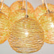 Hängeleuchte 7-flammig Carillon Eisen Gold mit elegantem, goldenem Drahtdesign