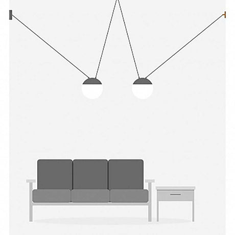 3er-Hängeleuchte Mine Space Weiß über einem grauen Sofa in einem modernen Wohnraum.