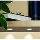 5er Möbeleinbauleuchten-Set Micro Line Mini LED rund auf einem Regal mit Buch und Pflanzen.