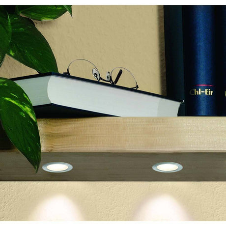 5er Möbeleinbauleuchten-Set Micro Line Mini LED rund in einer Vitrine mit Buch und Brille.