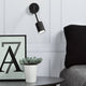 Explore Wandspot in Schwarz