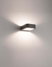 Acqua LED outdoor wall light 3000K dark grey IP54 on a wall with soft light.