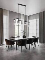 Modern Aelia LED pendant light Ø 72 cm, 5-light, above an elegant dining table. Stylish interior with elegant chairs.