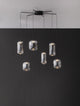 Aelia LED Pendelleuchte 6-flammig Ø 72cm Schwarz, Rauch mit eleganten Glaslampenschirmen an einem modernen Gestell.