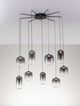 Aelia LED Pendelleuchte 9-flammig  Ø 82cm Schwarz, Rauch mit eleganten Glaslampenschirmen.