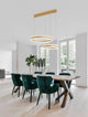 Agos LED Pendelleuchte Ø 60cm über modernem Esstisch mit grünen Stühlen in elegantem Raum.