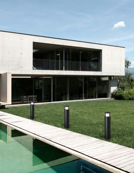 Agosto LED outdoor path light H 50cm black IP54 in modern industrial design beside a pool at a residential house.