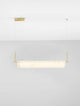Aider Pendelleuchte 3000K in elegantem Design mit goldfarbenem Aluminium und warmer Lichtatmosphäre.
