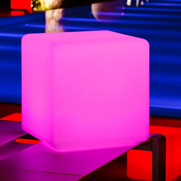 Battery-operated LED cube Big-Cube 43cm with app control in bright pink as a modern design object.