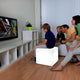 Battery LED Cube 35cm with app control in the living room as a seating cube for children while playing.