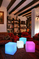 Battery LED Cube 35cm with app control in a stylish living room with cozy furniture.