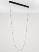 Alcinoe LED Pendelleuchte 3000K Schwarz, Gold über einem minimalistischen Raum. Elegantes Design mit dimmbarer Funktion.