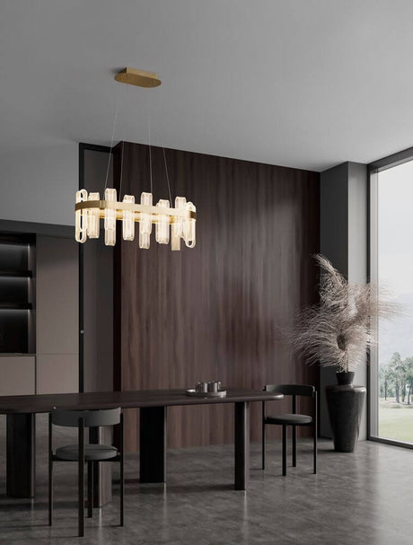 Argo LED pendant light 80 cm in a modern living space above a dining table, stylish design with a gold-colored frame.