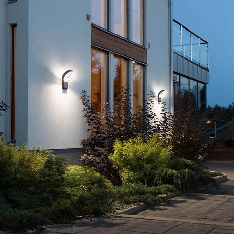Asti LED outdoor wall light 1400lm , 5000K anthracite, opal acrylic glass on a modern house outdoors.