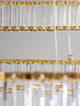 Aurelia LED Pendelleuchte Ø 80cm 3500K Detailaufnahme der Glasstäbe und Goldakzente.